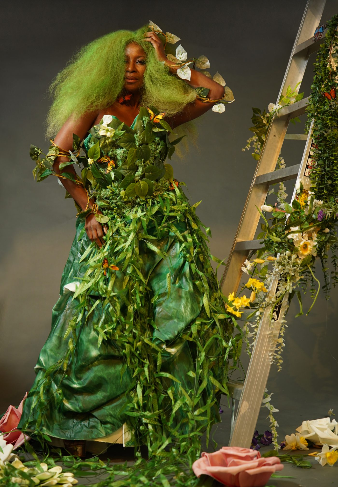 Bo Best, founder of Runway Recycled, in the Green Goddess botanical couture gown surrounded by flowers