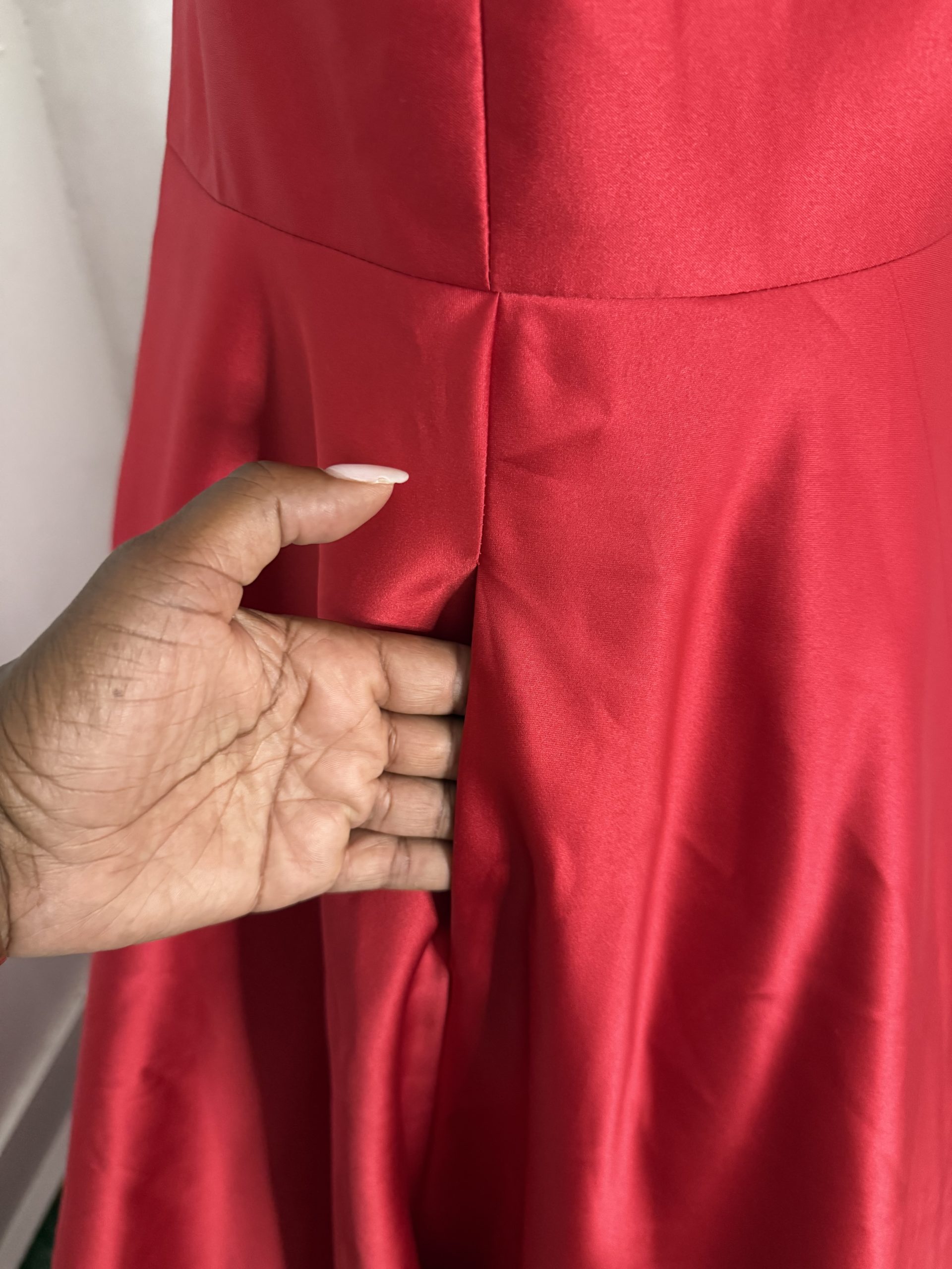 Red gown with hidden pocks on the Betsey & Adam